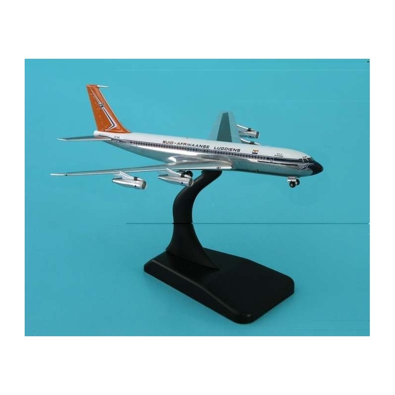 Model redukcyjny Boeing 707-300, skala 1:400, South African Airways. Biały kadłub, pomarańczowy ogon, czarne detale.