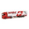 Model redukcyjny Mercedes Benz Actros, skala 1:87, HERPA. Czerwony ciągnik siodłowy z białą naczepą, logo Schoeni, krzyż.