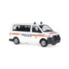 Model redukcyjny Volkswagen T5 Transporter Bus "Police Vaud", skala 1:87, biały z pomarańczowymi pasami i napisem "POLICE".