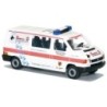Model redukcyjny VW T4 LR JUH Rettungshunde, skala 1:87. Biała karetka z czerwonym paskiem i niebieskimi psimi śladami.