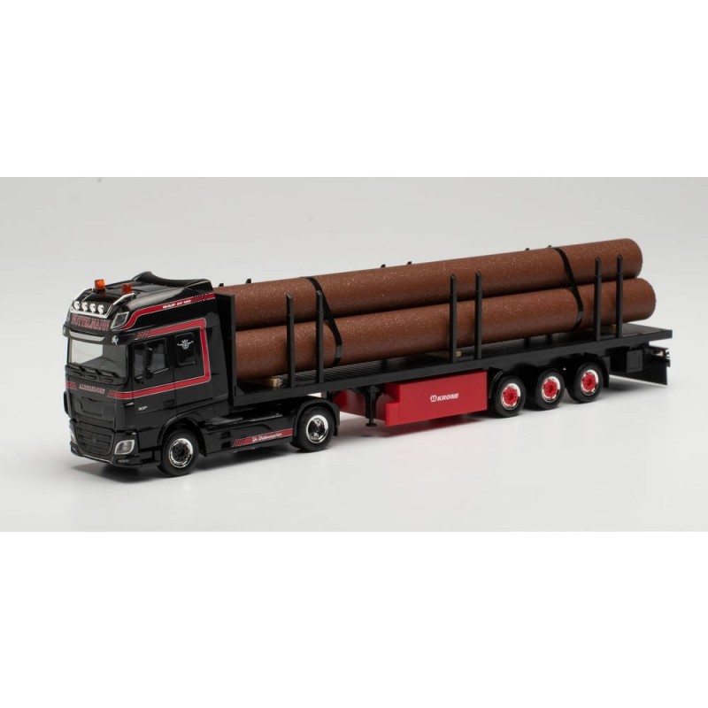 Model redukcyjny DAF XF SSC, skala 1:87, Herpa. Czarny ciągnik siodłowy z czerwonymi akcentami, naczepa z rurami.