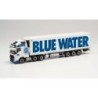 Model redukcyjny Volvo FH GL. XL 2020 6×2 "Blue Water" skala 1:87, Herpa. Biały ciągnik z niebieskim logo i naczepą z napisem "B