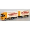Mercedes-Benz Actros MP2 L, skala 1:87, AWM. Żółty ciągnik siodłowy z białymi naczepami Goldberger.