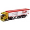Model redukcyjny MB Actros MP2, skala 1:87, AWM. Żółty ciągnik siodłowy z białą i czerwoną naczepą, malowanie Lutz.