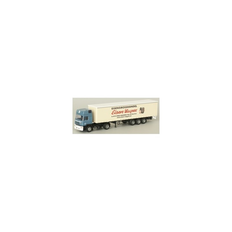 Model Steyr HD - G-KSZ, skala 1:87, AWM. Niebieska kabina, biała naczepa z czerwonym logotypem.