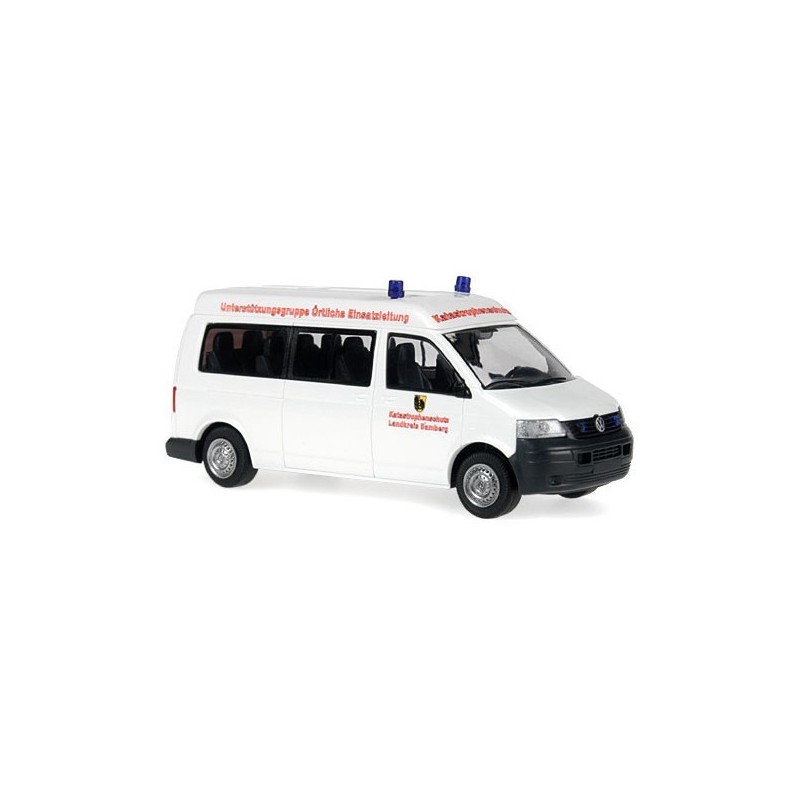 Model redukcyjny VW T5 Transporter Bus, skala 1:87, biały z czerwonymi napisami i niebieskimi światłami.