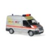 Model redukcyjny Ford Transit DRK Schwerte, skala 1:87, srebrny z pomarańczowymi pasami, logo Czerwonego Krzyża.