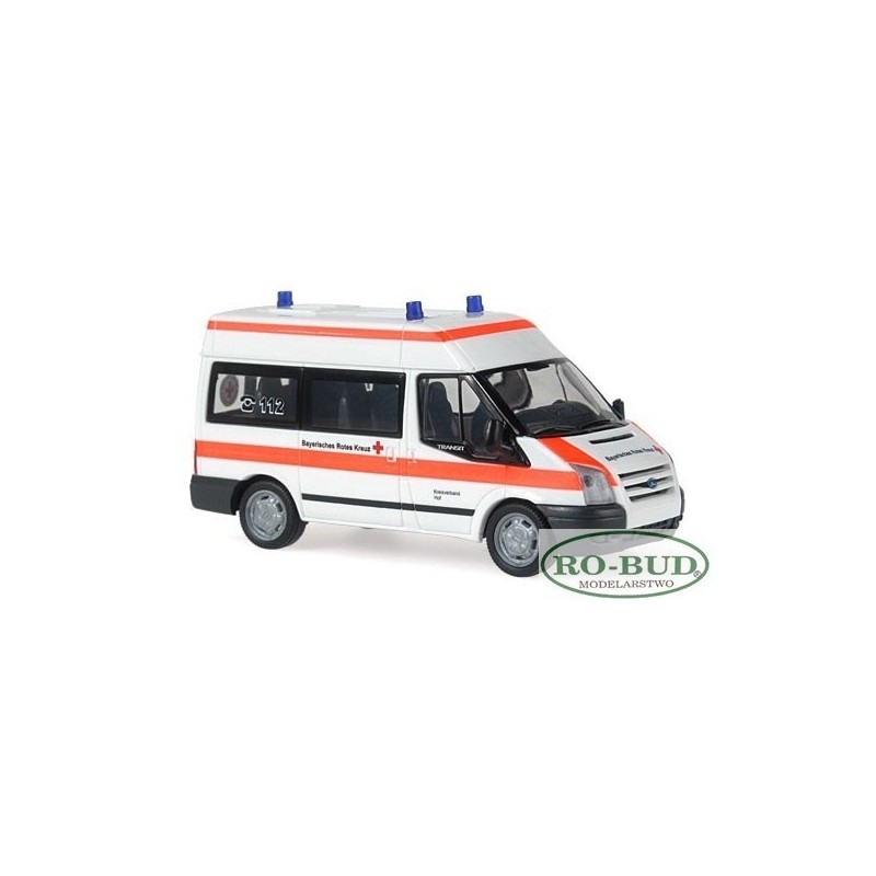 Model redukcyjny Ford Transit, skala 1:87, RO-BUD. Biała karetka z pomarańczowymi pasami, logo Bawarian Red Cross.