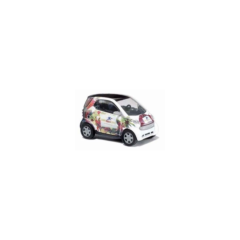 Model redukcyjny Smart Fortwo, skala 1:87, biały z kolorowym nadrukiem.