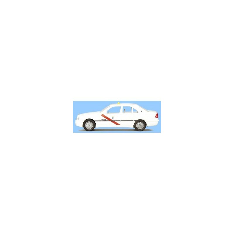 Model redukcyjny MB C-Klasse TAXI, skala 1:87. Biały samochód z czerwonym paskiem i żółtym światłem.