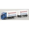 Model Volvo FH, skala 1:87, AWM. Błękitna kabina, białe naczepy z logotypem Zachariassen.