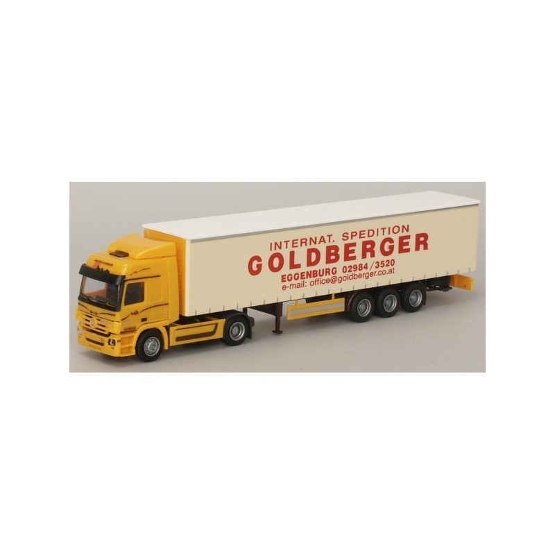 Model redukcyjny MB Actros, skala 1:87, AWM. Żółty ciągnik siodłowy z białą naczepą, logo Goldberger.