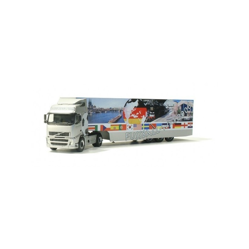 Model redukcyjny Volvo FH GL box semitrailer "WM 2006", skala 1:87, Herpa. Biała ciężarówka z naczepą ozdobioną flagami i grafik