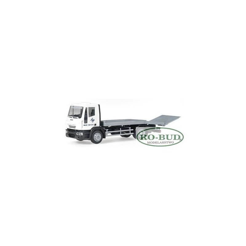 Model redukcyjny VECO Eurocargo, skala 1:87, producent RO-BUD. Biały samochód z platformą, logo firmy.