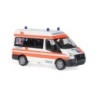 Model redukcyjny Ford Transit MD Bus "RKT Regensburg", skala 1:87, Herpa. Biała i pomarańczowa karetka, logo RKT.
