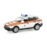 Model redukcyjny BMW X3S, skala 1:87, Herpa. Biały z pomarańczowym pasem, oznaczenia służb ratowniczych.