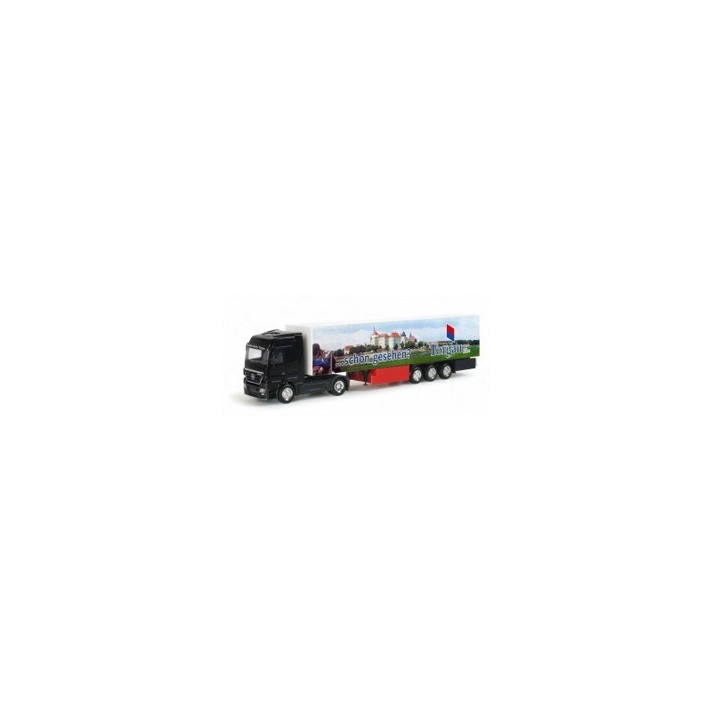 Model redukcyjny Mercedes-Benz Actros LH 02 "Kraftverkehr Torgau", skala 1:87, Herpa. Czarny ciągnik siodłowy.