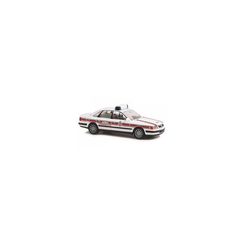 Model Audi 100 Policja, skala 1:87, RIETZE. Biały z czerwonymi pasami policyjny samochód.