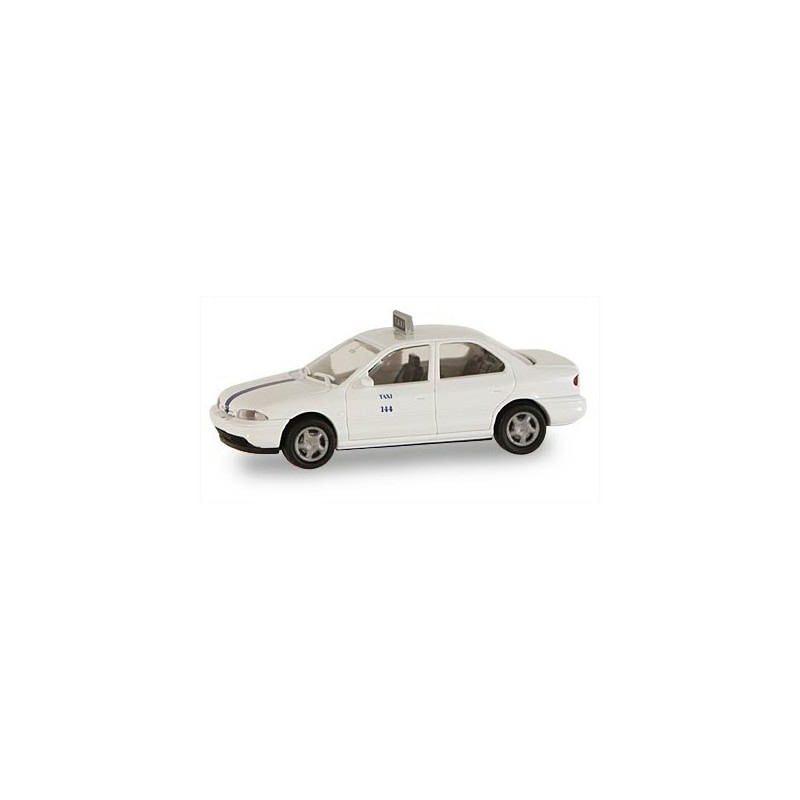 Model redukcyjny FORD Mondeo Taxi Spanien, skala 1:87. Biały samochód z niebieskimi akcentami.