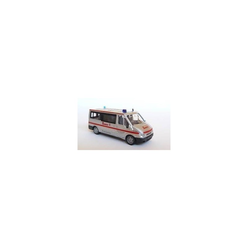 Ford Transit Johanitter, skala 1:87, Rietze. Biały samochód ratunkowy z czerwonymi pasami i napisem Johanniter.