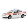 Model redukcyjny Ford Mondeo Stadtpolizei Zurych, skala 1:87. Biały samochód policyjny z pomarańczowymi pasami i napisem "Polize