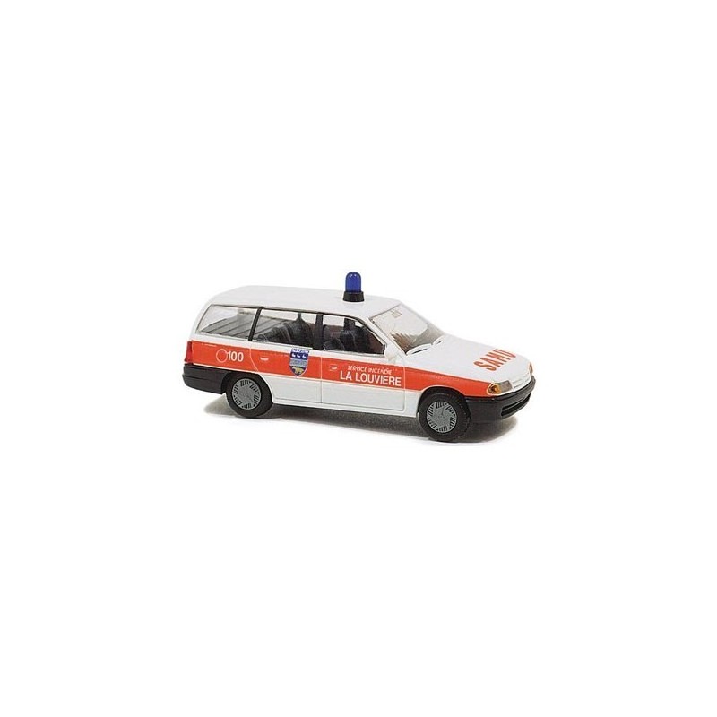 Model redukcyjny Opel Astra Caravan Rettungswagen, skala 1:87, biało-pomarańczowy, napis La Louviere.