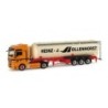 Model redukcyjny MAN TGX XXL "Hollenhorst", skala 1:87, Herpa. Pomarańczowy ciągnik, biała cysterna z logo.
