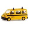 Model redukcyjny FORD Transit Ambulance, skala 1:87. Żółty samochód z czarnymi pasami, niebieskimi światłami.