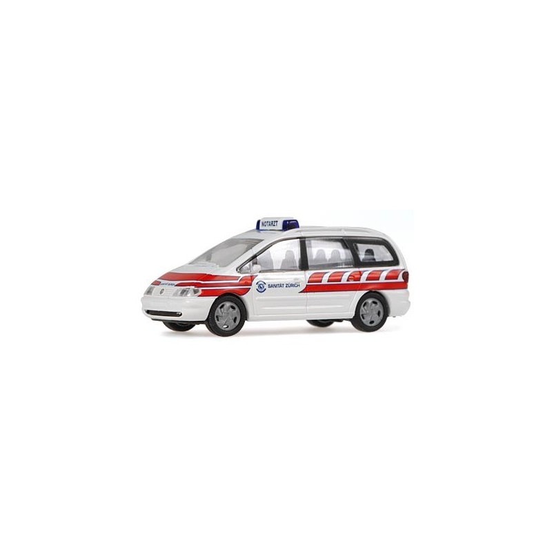 Model redukcyjny VW Sharan Sanität Zürich, skala 1:87. Biały z czerwonymi pasami, logo Sanität Zürich.
