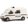 Model redukcyjny FORD Transit Policie, skala 1:87. Biały van z zielonym paskiem i napisem "POLICIE".