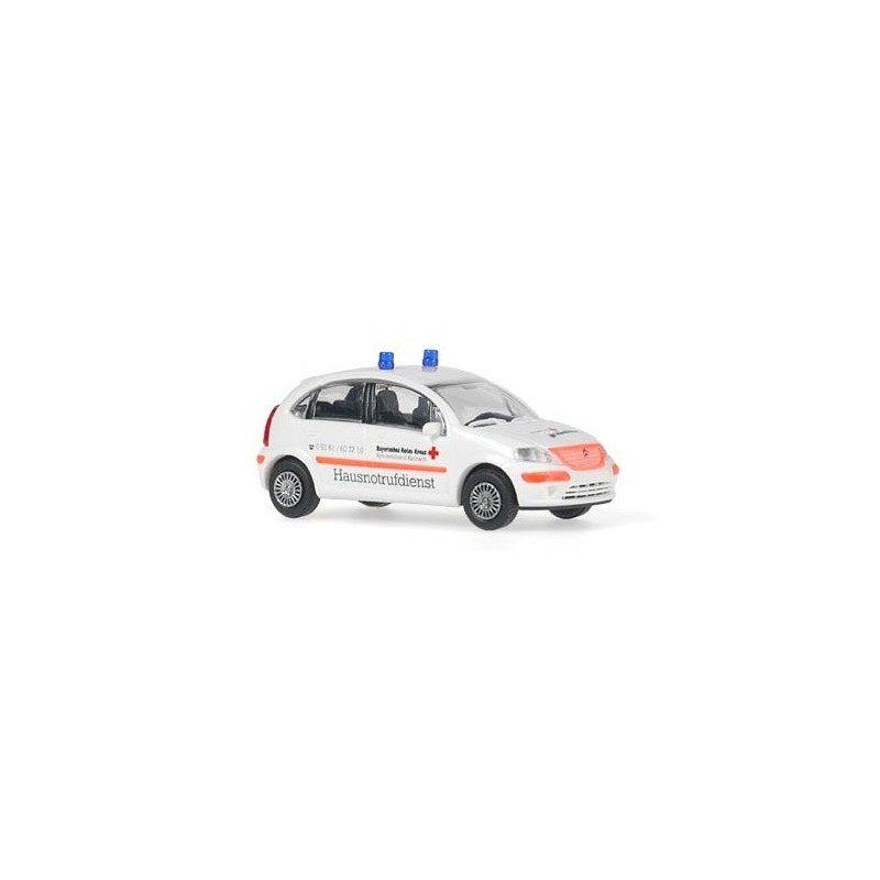Model redukcyjny Citroen C3, skala 1:87, BRK Hausnotrufdienst. Biały samochód z sygnalizacją i czerwonymi akcentami.
