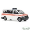 Model redukcyjny Volkswagen T5 Transporter, skala 1:87, RO-BUD. Biały policyjny samochód z pomarańczowym paskiem.