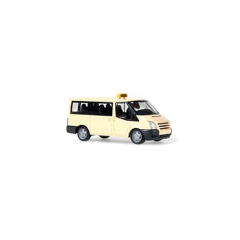 Model redukcyjny Ford Transit 2006 Taxi, skala 1:87. Jasnożółty taksówka z czarnymi akcentami i żółtymi sygnałami.