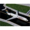 Model samolotu Boeing 727-200, skala 1/400, GeminiJets. Biały kadłub, logo PLANET Holidays.