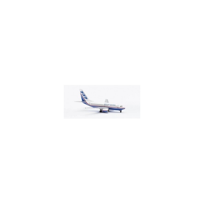 Model redukcyjny Boeing 737-600, skala 1:400, HERPA. Biały kadłub, niebieskie skrzydła z czerwonym i niebieskim paskiem.